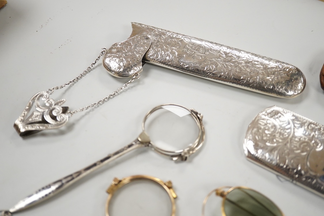 An Edwardian engraved silver spectacle case, by Boots Pure Drug Company, Chester, 1903, one other engraved silver spectacles case, hallmarks rubbed, a pair of 830 standard white metal and niello lorgnettes, two other pai